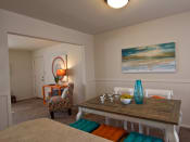 Thumbnail 8 of 13 - Dining area overlooking living room with table and multicolored furniture