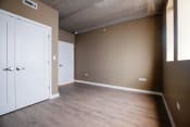 Thumbnail 9 of 24 - an empty room with brown walls and a white door