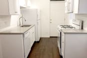 Thumbnail 32 of 38 - a kitchen with white appliances and white cabinets