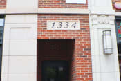 Thumbnail 6 of 23 - a brick building with the number 1334 on it