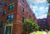Thumbnail 3 of 38 - a red brick building on a sunny day