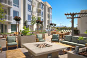 Thumbnail 1 of 55 - San Fransisco CA Luxury Apartments - Strata at Mission Bay - Outdoor Lounge Area with Firepit, Grills & Seating