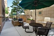 Thumbnail 25 of 48 - Pet-Friendly Apartments in San Jose CA - Aviara - Outdoor Grill Area with Shaded Seating