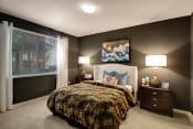 Thumbnail 8 of 48 - Two-Bedroom Apartments in San Jose, CA- Aviara- Wall-to-Wall Carpeting, Dark Colored Walls, Large Window, and Identical Nightstands