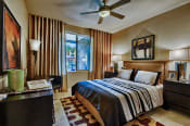 Thumbnail 19 of 21 - Apartments for Rent in Chandler AZ - Monument - Bedroom with Plush Carpeting, Large Window and Ceiling Fan