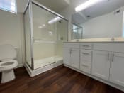 Thumbnail 4 of 48 - unfurnished bathroom with updated white cabinetry
