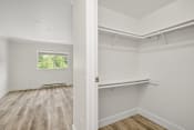 Thumbnail 52 of 57 - a bedroom with hardwood floors and white walls