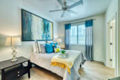 Thumbnail 6 of 21 - Studio, One, & Two-Bedroom Luxury Apartments In Phoenix, AZ - Level At Sixteenth - Bedroom With Spacious Bedroom, Glass Nightstand, And Yellow Decorative Bedding