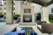 Thumbnail 15 of 21 - Phoenix AZ Apartments for Rent - Level at Sixteenth - Outdoor Lounge Area with Fireplace and TV