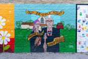 Thumbnail 43 of 84 - a mural on the side of a brick wall