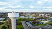Thumbnail 63 of 84 - an aerial view of a water tower overlooking a city with a river