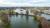 Thumbnail 65 of 84 - an aerial view of a lake with a city in the background