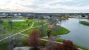Thumbnail 66 of 84 - an aerial view of a park next to a lake