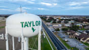 Thumbnail 73 of 84 - a water tower with the name of the city of taylors water tower