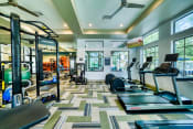 Thumbnail 3 of 21 - Fitness Center with Treadmill and Gym Equipment