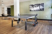 Thumbnail 23 of 88 - Apartments in Mission Valley for Rent - Community Ping-Pong Table with Nearby Seating and Natural Light.