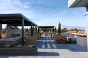 Thumbnail 30 of 83 - Apartments In Burlingame, CA For Rent - Rooftop Patio Lounge With Louge Seating, Potted Plants, Fire Pit, And Grilling Area.