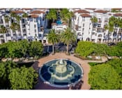 Thumbnail 5 of 88 - aerial view of promenade rio vista apartments and water fountain with lush landscaping