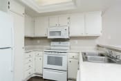 Thumbnail 30 of 52 - Two Bedroom Apartments in Thousand Oaks CA - Westlake Canyon - White Kitchen with Modern Appliances