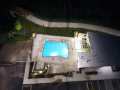 Thumbnail 12 of 28 - arial view of the pool at night
