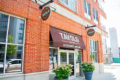 Thumbnail 9 of 10 - a brick building with a brown awning and a sign that says taylor restaurant and