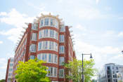 Thumbnail 4 of 10 - a red brick building with white trimmed windows