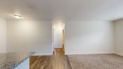 Thumbnail 48 of 55 - a living room with white walls and hardwood floors at Bennett Ridge Apartments, Oklahoma City, Oklahoma