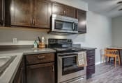 Thumbnail 5 of 18 - Image of kitchen with stainless steel oven and microwave