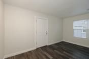 Thumbnail 23 of 55 - a bedroom with hardwood floors and white walls at Bennett Ridge Apartments, Oklahoma City, Oklahoma
