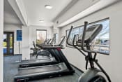 Thumbnail 35 of 44 - the gym at the resort has cardio equipment and a large window