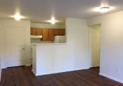 Thumbnail 5 of 11 - Columbine West Apartments Living Room and Kitchen