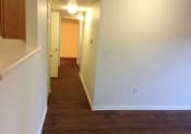 Thumbnail 7 of 11 - Columbine West Apartments Living Room and Hallway