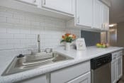 Thumbnail 5 of 39 - Novela Apartments Kitchen sink and subway tile
