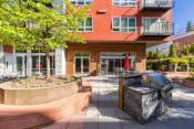 Thumbnail 8 of 23 - Koi Apartments in Ballard, Washington Exterior and Patio with BBQ's