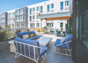 Thumbnail 37 of 49 - Meetinghouse Apartments Outdoor Lounge Area and BBQ Grill