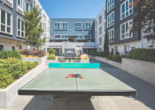 Thumbnail 33 of 49 - Meetinghouse Apartments Outdoor Courtyard and Ping Pong Table