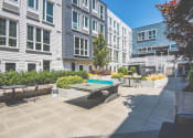 Thumbnail 32 of 49 - Meetinghouse Apartments Outdoor Courtyard and Ping Pong Table