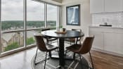 Thumbnail 5 of 66 - Cozy dining room with large windows and view of the city at CityView on Meridian, Indianapolis, IN,46208
