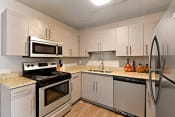 Thumbnail 1 of 40 - A newly renovated kitchen with stainless steel appliances at Heritage Hill Estates Apartments, Cincinnati, Ohio 45227