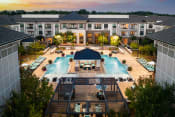 Thumbnail 1 of 19 - The Juncture Apartments aerial view of one resort-style pool and surrounding sundeck
