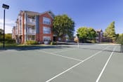 Thumbnail 14 of 24 - Belle Harbour Apartments outdoor lighted tennis court