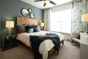 Thumbnail 17 of 19 - The Juncture Apartments bedroom with ceiling fans