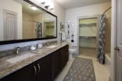 Thumbnail 18 of 19 - The Juncture Apartments bathroom with double vanity and linen closet