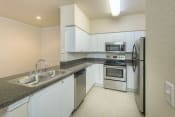 Thumbnail 15 of 19 - Kitchen with stainless steel appliances
