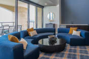 Thumbnail 18 of 75 - semi-circular couches around a circular coffee table indoors at The Apex at CityPlace, Overland Park, KS