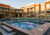 Thumbnail 8 of 75 - outdoor hot tub surrounded by apartment homes at The Apex at CityPlace, Overland Park, Kansas