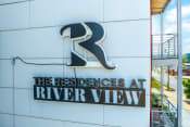 Thumbnail 2 of 36 - the residences at river view sign on the side of the building