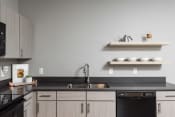 Thumbnail 23 of 36 - Pet Friendly Apartments Des Moines kitchen with modern finishes