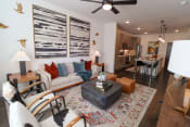 Thumbnail 2 of 41 - The Wren 1 bedroom model apartment home living space with ceiling fan located in Lawrenceville, GA
