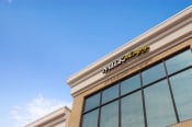 Thumbnail 36 of 40 - a walmart store with a blue sky in the background